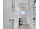 Bathroom features a shower/tub combo, wood look flooring, and bright natural light at 206 Hamby St, Clayton, NC 27520