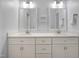 Bathroom features a dual vanity with white cabinets and quartz countertop at 206 Hamby St, Clayton, NC 27520