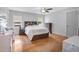 Comfortable bedroom with a ceiling fan, hardwood floors, and two large windows at 206 Hamby St, Clayton, NC 27520