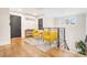 Hallway with a 'Grateful' sign and seating area features wooden floors and black doors at 206 Hamby St, Clayton, NC 27520