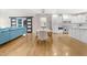 Bright, open floorplan featuring hardwood floors and seamless connection between the living, dining, and kitchen areas at 206 Hamby St, Clayton, NC 27520