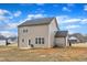 Large backyard of a home with a view of other neighborhood houses at 252 Olde Place Dr, Zebulon, NC 27597