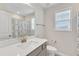 Bathroom with a white vanity, a large mirror, and a shower with a blue curtain at 252 Olde Place Dr, Zebulon, NC 27597