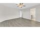 Bright, airy bedroom with neutral walls and a ceiling fan at 252 Olde Place Dr, Zebulon, NC 27597