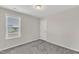 Cozy bedroom with neutral carpeting and a window for natural light at 252 Olde Place Dr, Zebulon, NC 27597