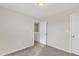 Bedroom with carpeted floors and neutral walls with access to the hallway at 252 Olde Place Dr, Zebulon, NC 27597