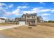 Two-story home with two-car garage, neutral siding, and well-manicured front yard at 252 Olde Place Dr, Zebulon, NC 27597