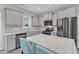 Modern kitchen featuring stainless steel appliances and a spacious granite island with seating at 252 Olde Place Dr, Zebulon, NC 27597