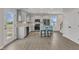 Modern kitchen featuring gray cabinetry, stainless steel appliances, an island with seating, and light-filled brightness at 252 Olde Place Dr, Zebulon, NC 27597
