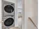 Laundry area with a stacked washer and dryer with access to another room at 252 Olde Place Dr, Zebulon, NC 27597