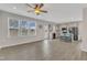 Bright open-plan living space features a modern kitchen with a center island and bar seating, plus large bright windows at 252 Olde Place Dr, Zebulon, NC 27597