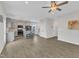 This bright room offers a kitchen with stainless steel appliances and an island with seating, flowing into the living area at 252 Olde Place Dr, Zebulon, NC 27597