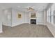 The living room offers a fireplace with built-ins, complemented by natural light streaming through the windows at 252 Olde Place Dr, Zebulon, NC 27597