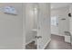 Half bathroom with pedestal sink and oval mirror, conveniently located near the entryway at 252 Olde Place Dr, Zebulon, NC 27597
