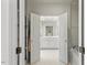 Well-lit bathroom offers a shower, soaking tub, and double doors to a large vanity at 2602 Vintage Hill Ct, Durham, NC 27712
