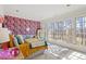 Stylish bedroom with bold floral wallpaper, large windows, and a cozy, inviting atmosphere at 2602 Vintage Hill Ct, Durham, NC 27712