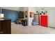 Modern bedroom with dark blue accent wall, neutral carpet and red lockers at 2602 Vintage Hill Ct, Durham, NC 27712