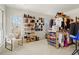 Large closet with clothing and shoes offers lots of storage and natural light at 2602 Vintage Hill Ct, Durham, NC 27712