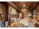 Elegant dining room featuring a fireplace, chandelier, and ample seating perfect for gatherings at 2602 Vintage Hill Ct, Durham, NC 27712