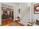 Welcoming entryway with staircase, hardwood floors, zebra rug, and stylish decor, creating a comfortable ambiance at 2602 Vintage Hill Ct, Durham, NC 27712