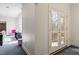 Entryway features large double doors with glass and neutral colored carpet at 2602 Vintage Hill Ct, Durham, NC 27712