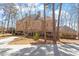 Beautiful brick home surrounded by mature trees and lush landscaping at 2602 Vintage Hill Ct, Durham, NC 27712