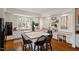 Bright kitchen featuring white cabinets, a center island, and eat-in breakfast nook, creating a cozy atmosphere at 2602 Vintage Hill Ct, Durham, NC 27712