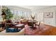 Bright living area featuring comfortable seating, large windows, and natural light at 2602 Vintage Hill Ct, Durham, NC 27712