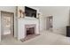 Comfortable living room features fireplace and multiple doorways leading to other rooms at 2602 Vintage Hill Ct, Durham, NC 27712