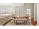 Inviting living area featuring hardwood floors, and large windows offering an abundance of natural light at 2602 Vintage Hill Ct, Durham, NC 27712