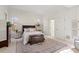 Large main bedroom with a rug features hardwood floors and plenty of natural light at 2602 Vintage Hill Ct, Durham, NC 27712