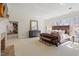 Spacious main bedroom features a sitting area, fireplace, and many windows at 2602 Vintage Hill Ct, Durham, NC 27712