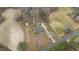 Aerial view of a single-Gathering home with long drive, set back off the road, and surrounded by flowering trees at 3068 Benson Rd, Angier, NC 27501