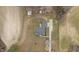 Aerial view of a single-Gathering home with a long drive, set back off the road, and surrounded by fields and trees at 3068 Benson Rd, Angier, NC 27501