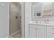 Tiled walk-in shower and sink vanity with storage in bathroom at 3068 Benson Rd, Angier, NC 27501