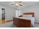Bedroom with neutral walls, hardwood floors, and a large wooden bed at 3068 Benson Rd, Angier, NC 27501