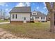 Back of the house with a door and stairs at 3068 Benson Rd, Angier, NC 27501