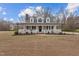 Charming two-story home with a welcoming front porch and traditional architectural details at 3068 Benson Rd, Angier, NC 27501