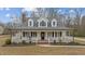 Charming front exterior with a welcoming porch and beautifully landscaped yard, a true curb appeal at 3068 Benson Rd, Angier, NC 27501