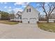 Attached two-car garage of the home with a large driveway at 3068 Benson Rd, Angier, NC 27501