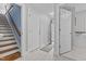 Hallway and staircase with hard wood flooring at 3068 Benson Rd, Angier, NC 27501