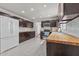 Spacious kitchen with a white refrigerator and dark brown cabinets at 3068 Benson Rd, Angier, NC 27501