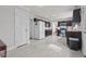 Spacious kitchen with white appliances, dark cabinets, and light tile floors at 3068 Benson Rd, Angier, NC 27501