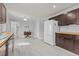 Kitchen with tile flooring and stainless steel refrigerator at 3068 Benson Rd, Angier, NC 27501