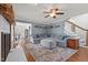 Spacious living room with a cozy fireplace, hardwood floors, and a comfortable sectional sofa at 3068 Benson Rd, Angier, NC 27501