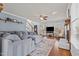 Bright living room showcasing a fireplace, large windows, and hardwood floors at 3068 Benson Rd, Angier, NC 27501