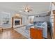 Cozy living room with a fireplace, hardwood floors, and comfortable seating at 3068 Benson Rd, Angier, NC 27501