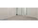 Neutral bedroom featuring neutral carpet, white doors, and base trim, creating a clean space at 31 Black Creek Dr, Lillington, NC 27546