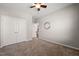 Neutral bedroom with a ceiling fan, carpet, closet and doorway at 3356 Longleaf Estates Dr, Raleigh, NC 27616