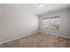 Clean, carpeted bedroom features a double window for natural lighting at 3356 Longleaf Estates Dr, Raleigh, NC 27616